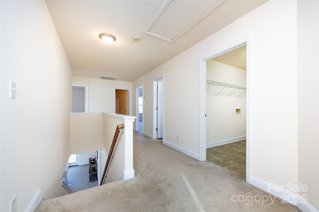 hallway featuring light carpet