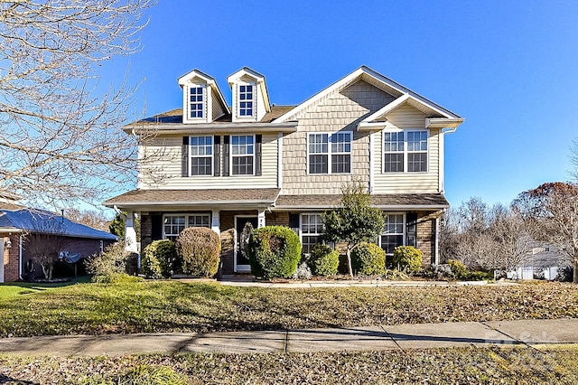 view of front of home featuring a front yard