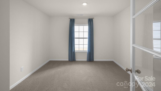 empty room with carpet floors