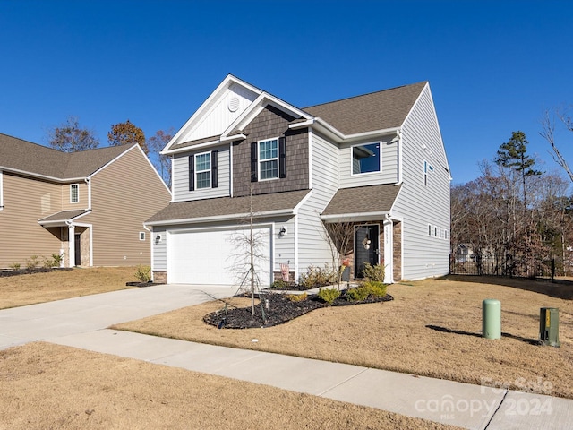 15533 Capps Rd, Charlotte, NC 28278 - view of front facade featuring concrete driveway, an attached garage, roof with shingles, and a front lawn