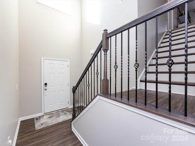 15533 Capps Rd, Charlotte, NC 28278 - staircase featuring wood finished floors and a towering ceiling