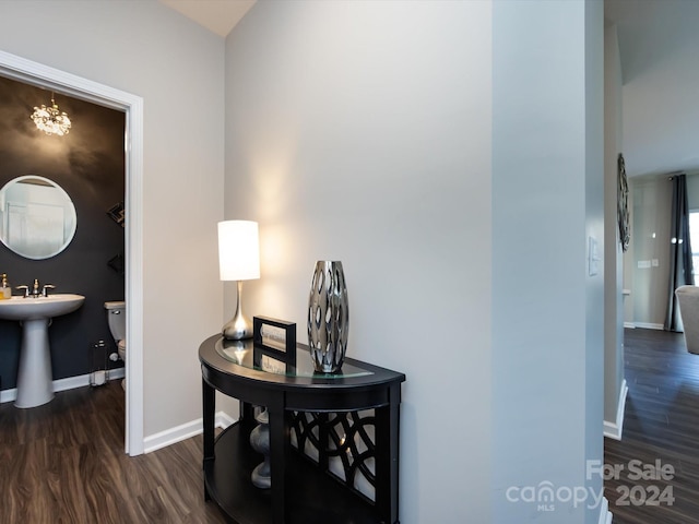 15533 Capps Rd, Charlotte, NC 28278 - hall with wood finished floors and a chandelier