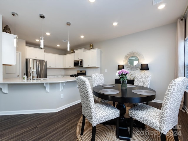 15533 Capps Rd, Charlotte, NC 28278 - dining space featuring dark wood-type flooring and recessed lighting