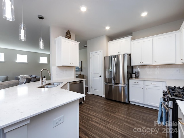 15533 Capps Rd, Charlotte, NC 28278 - kitchen featuring appliances with stainless steel finishes, open floor plan, white cabinets, decorative backsplash, and dark wood-style floors