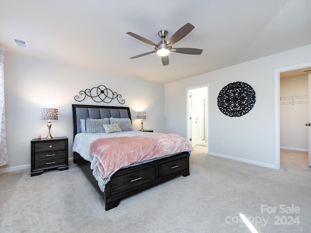 15533 Capps Rd, Charlotte, NC 28278 - bedroom featuring light carpet, a spacious closet, a ceiling fan, and connected bathroom