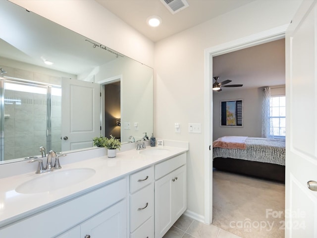 15533 Capps Rd, Charlotte, NC 28278 - ensuite bathroom featuring double vanity, a stall shower, ceiling fan, and tile patterned flooring