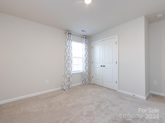 15533 Capps Rd, Charlotte, NC 28278 - unfurnished bedroom featuring carpet flooring and a closet