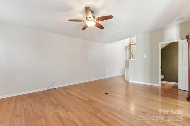 spare room featuring ceiling fan and light hardwood / wood-style flooring