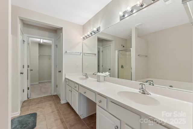 bathroom featuring vanity, shower with separate bathtub, and tile patterned floors