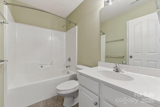 full bathroom with  shower combination, tile patterned floors, vanity, and toilet