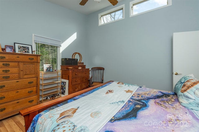 bedroom with ceiling fan and hardwood / wood-style flooring