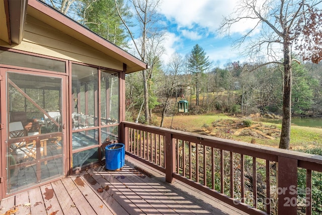 wooden deck featuring a sunroom