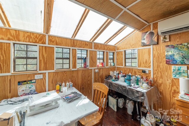 dining space featuring a wall mounted AC, wooden walls, vaulted ceiling, and hardwood / wood-style flooring