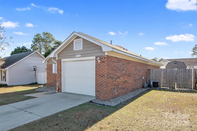 view of property exterior with central AC unit and a yard