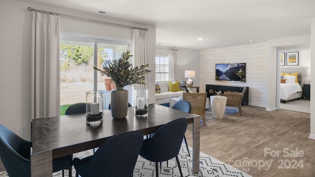 dining space with light hardwood / wood-style floors