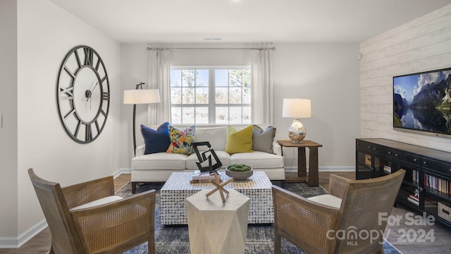 living room with dark hardwood / wood-style flooring