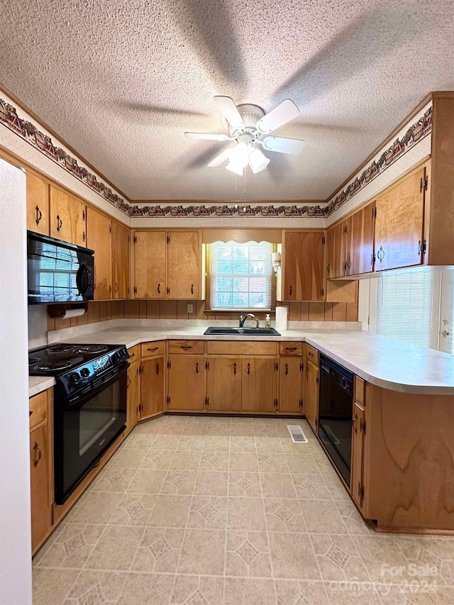 kitchen with a textured ceiling, sink, ceiling fan, and black appliances