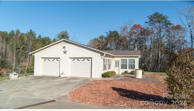 single story home featuring a garage