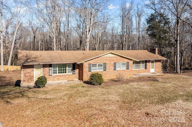 ranch-style house with a front lawn