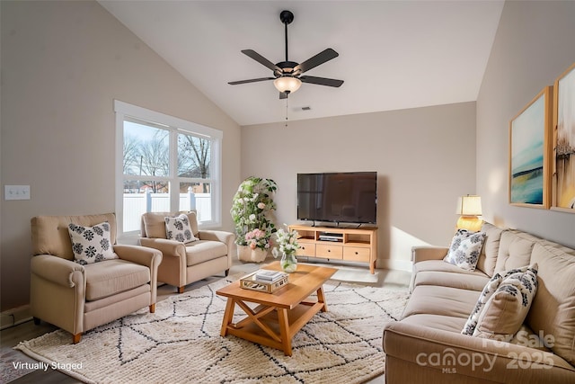 living room featuring vaulted ceiling, ceiling fan, and light hardwood / wood-style floors