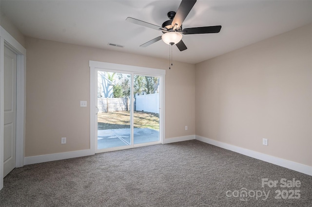 spare room with ceiling fan and carpet flooring