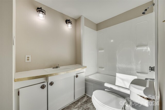 full bathroom featuring bathtub / shower combination, vanity, and toilet