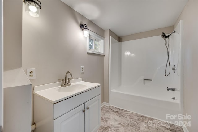 bathroom featuring vanity and bathtub / shower combination