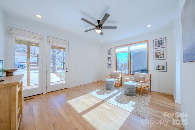 unfurnished room featuring ceiling fan and light hardwood / wood-style floors