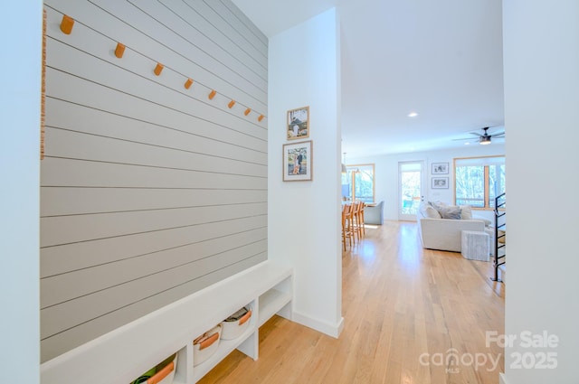 mudroom featuring ceiling fan and light hardwood / wood-style floors