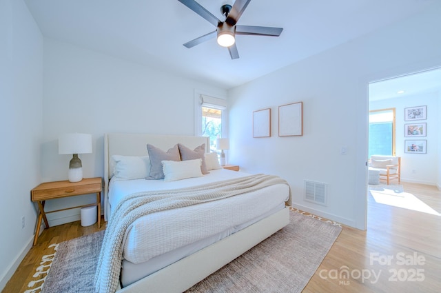 bedroom featuring ceiling fan and light hardwood / wood-style flooring