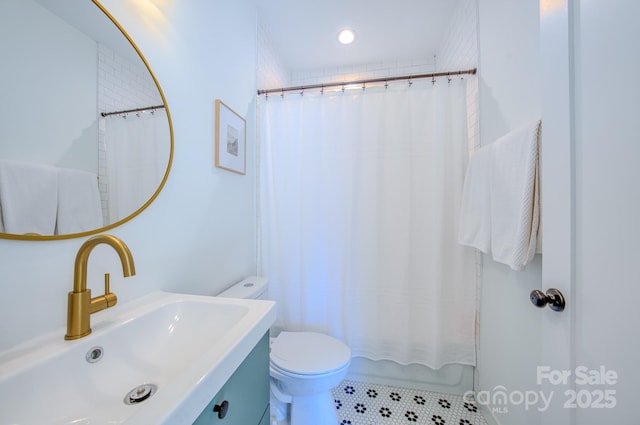 full bathroom with sink, tile patterned flooring, shower / tub combo, and toilet