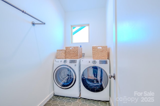 laundry room featuring light tile patterned floors and washer and dryer