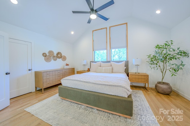 bedroom featuring hardwood / wood-style flooring, ceiling fan, and vaulted ceiling