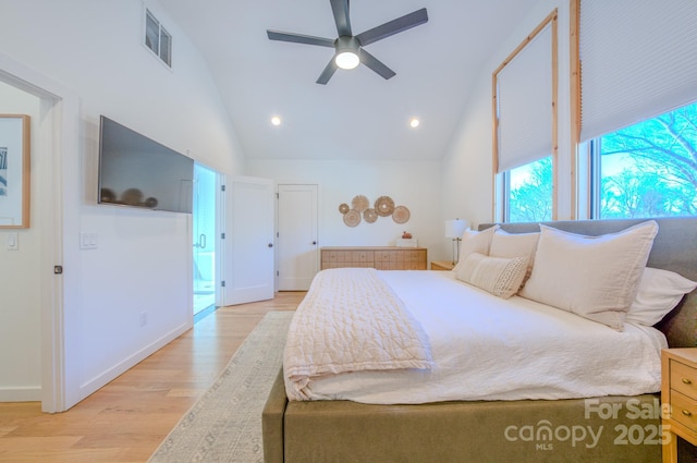 bedroom featuring ceiling fan, light hardwood / wood-style flooring, and high vaulted ceiling