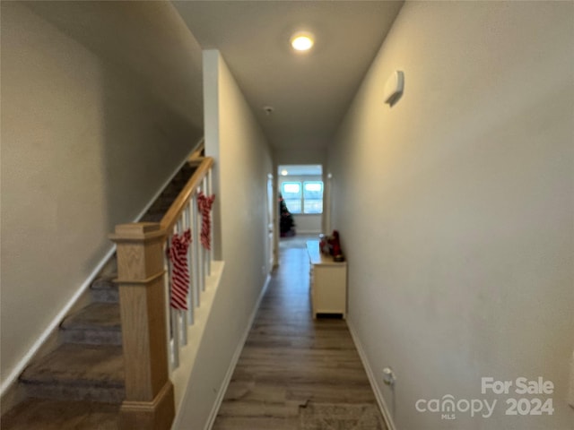 hall with dark wood-type flooring