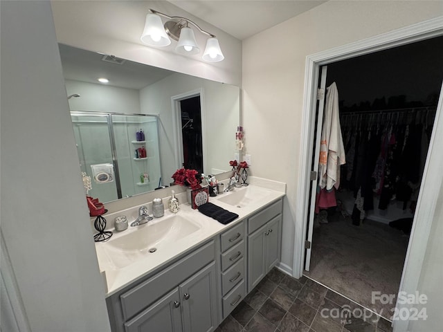 bathroom with vanity and an enclosed shower