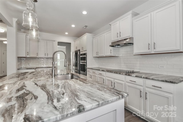 kitchen with pendant lighting, sink, decorative backsplash, double oven, and white cabinetry