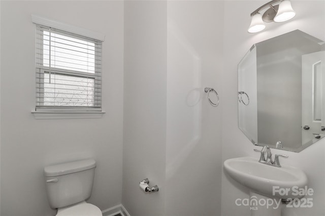 bathroom with sink and toilet