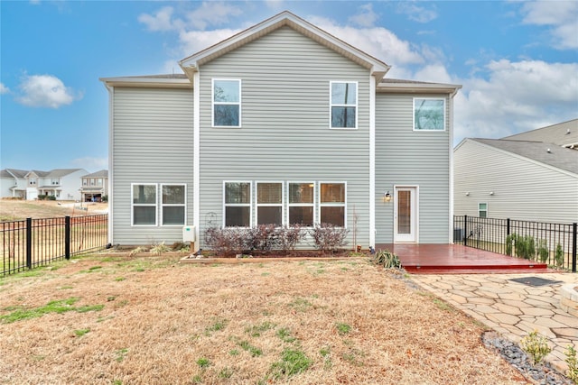 back of house with a wooden deck