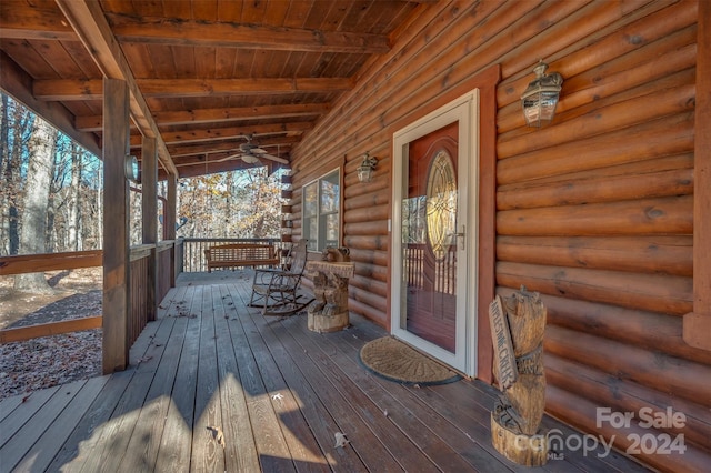 deck featuring ceiling fan and a porch