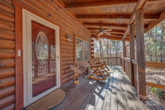 wooden terrace with covered porch and ceiling fan