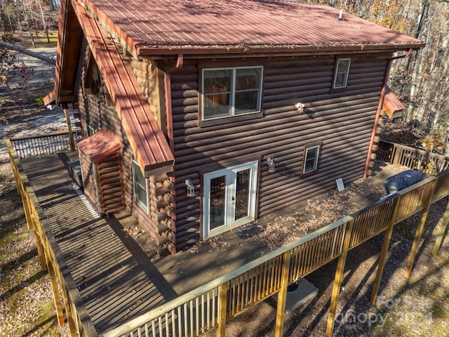 view of side of property featuring a wooden deck