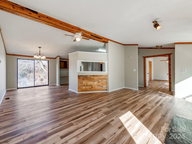 unfurnished living room with hardwood / wood-style flooring, ceiling fan with notable chandelier, and crown molding