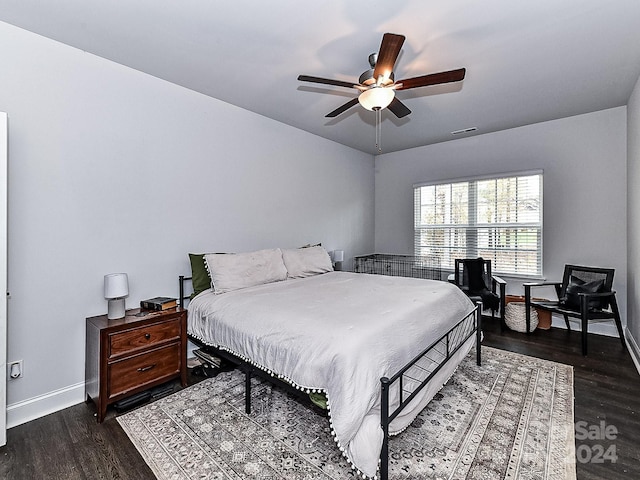 bedroom featuring dark hardwood / wood-style floors and ceiling fan