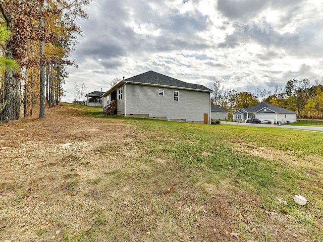 view of side of home featuring a yard