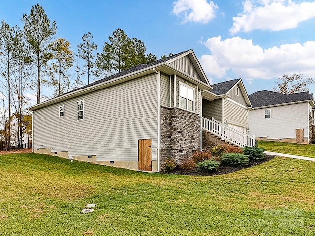 view of home's exterior with a lawn