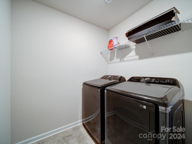 laundry area with independent washer and dryer