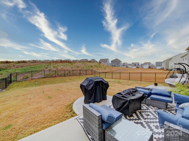 view of yard with outdoor lounge area and a patio