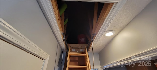 interior details with a textured ceiling