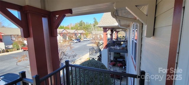 view of patio featuring a balcony